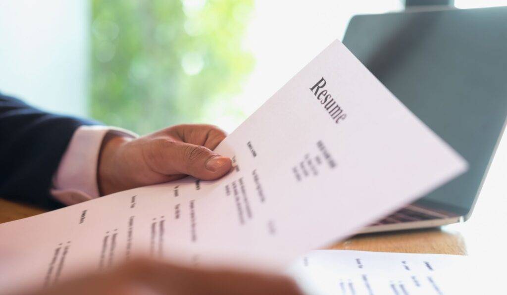 Hands holding a resume